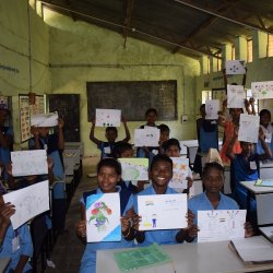 Kids of class 5th to 10th showing their drawings.